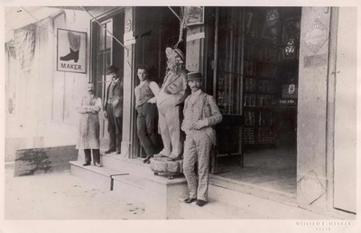 Four men standing in front of Cigar Store